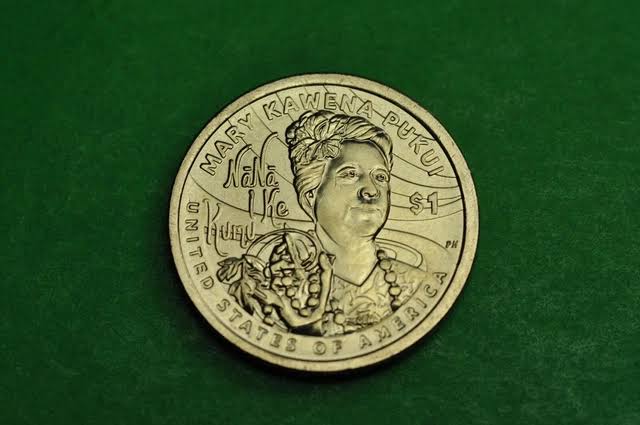 2025 silver dollar struck-through mint error showing depression in the coin field where foreign material was between die and planchet during striking